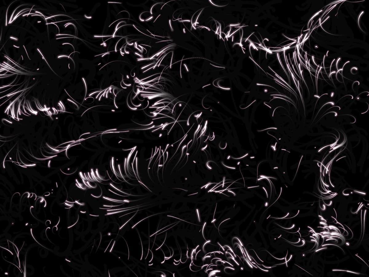 Pale pink particle trails moving through a flow field on black